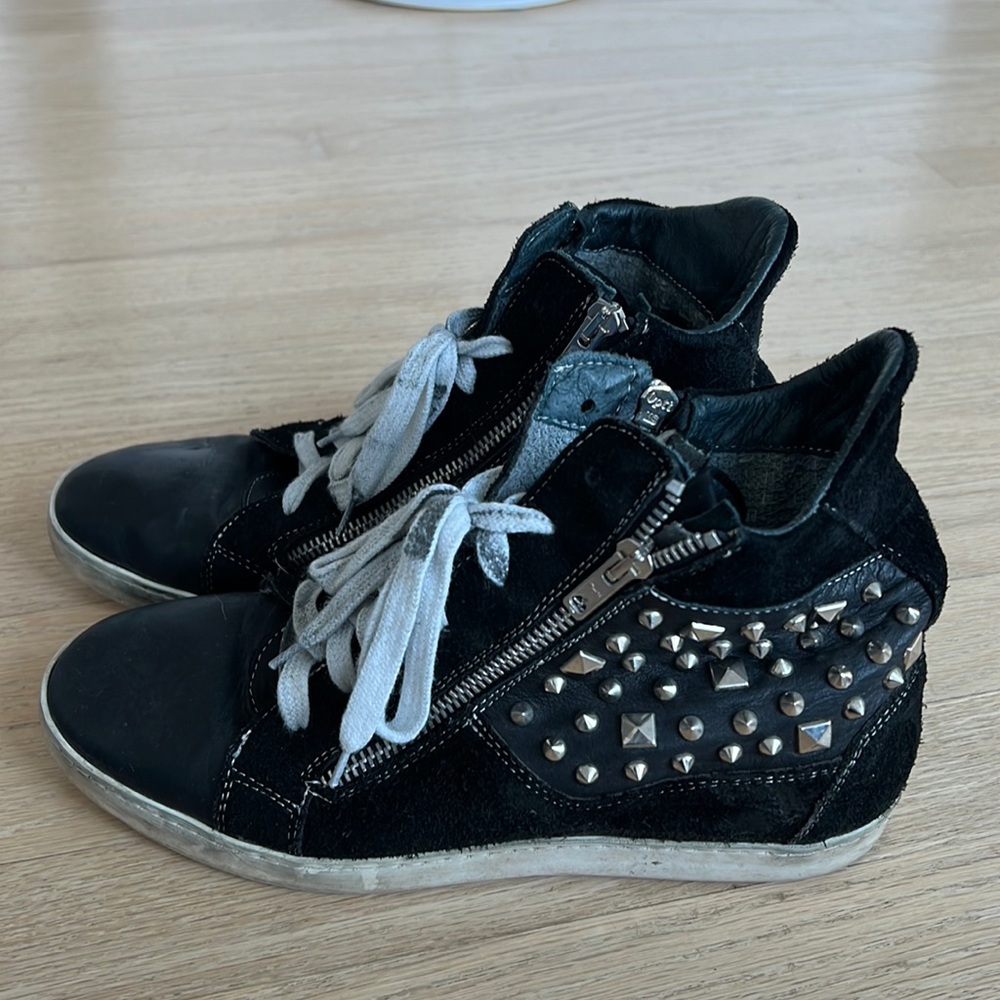 Edgy rock and roll studded sneakers